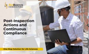 Quality team discussing post-inspection FDA compliance in biotech facility