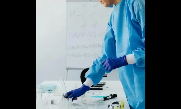 Laboratory compliance specialists and clinical staff reviewing CLIA regulations, certification standards, and diagnostic testing procedures in a modern medical laboratory.